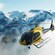 A helicopter flying above snowcapped mountains